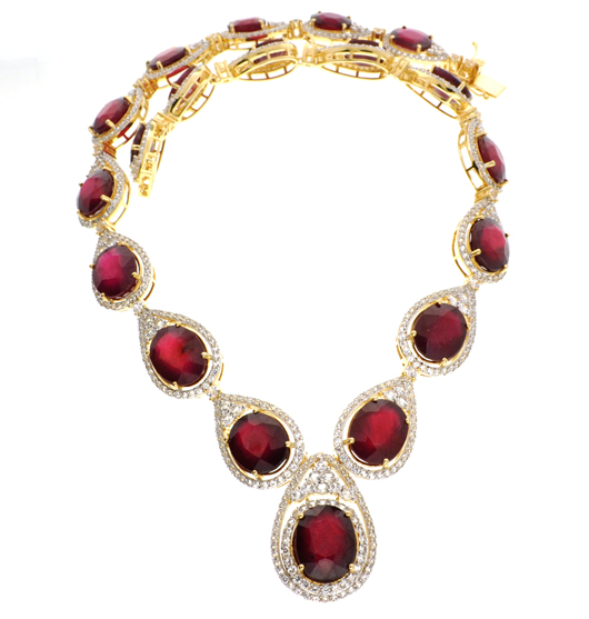 Ruby and sapphire necklace, gold over silver. Government Auction image.