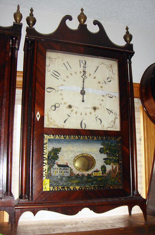   Pillar-and-scroll clock by Connecticut clockmaker Eli Terry, one of several vintage clocks in the sale. Tim’s Inc. Auctions.