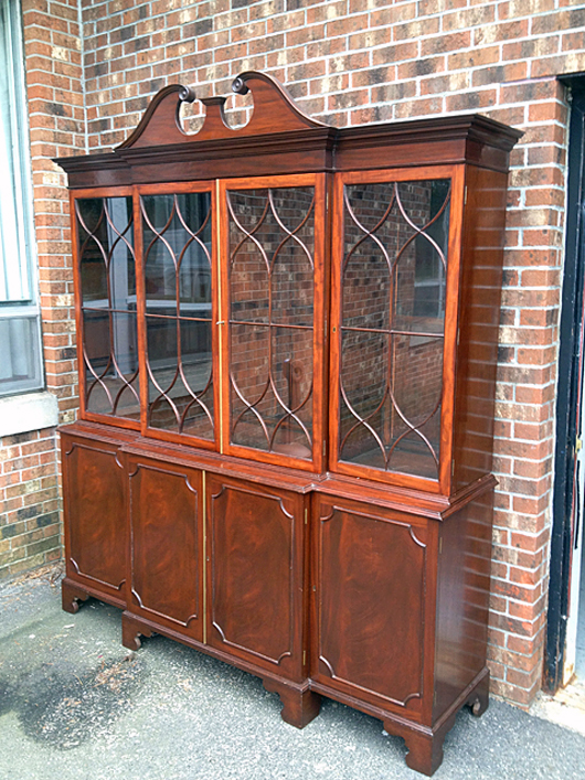 This stunning and monumental mahogany breakfront is just one of many antique furnishings that will cross the block. Tim’s Inc. Auctions.