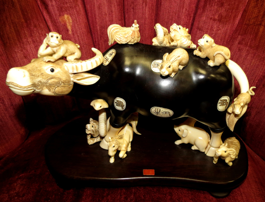 Ivory over ebony buffalo with astrological animal carvings. Est. $1,600-$4,000. Image courtesy of Carstens Galleries.