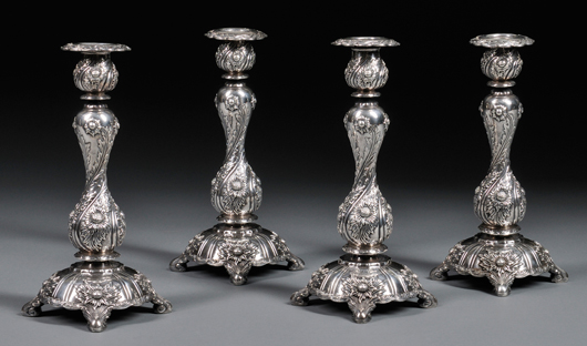 Four Tiffany & Co. Chrysanthemum pattern sterling silver candlesticks, New York, early 20th century, 10 inches high. Estimate: $18,000-$22,000. Skinner Inc. image.