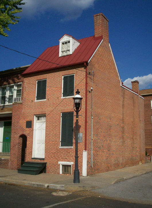 Exterior of the Edgar Allan Poe House and Museum, a National Historic Landmark located at 203 N. Amity St. in Baltimore, Maryland. Poe resided there in the 1830s. Displays in the museum include a lock of Poe's hair. 