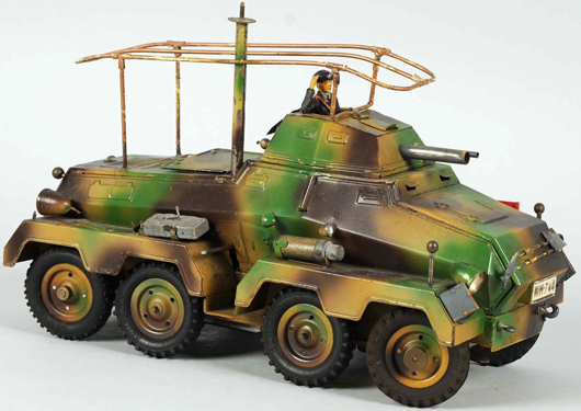 Hausser eight-wheeled armored car, 12 inches long, electric lights, $6,600. Morphy Auctions image.