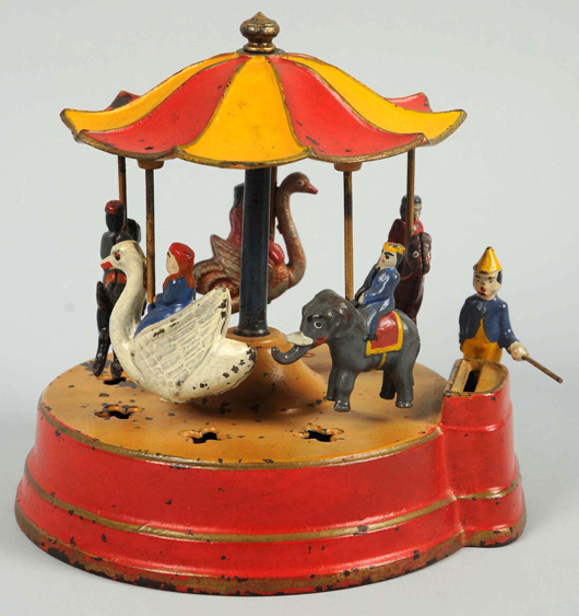 Kyser & Rex ‘Merry-Go-Round’ cast-iron mechanical bank, $126,000. Morphy Auctions image.