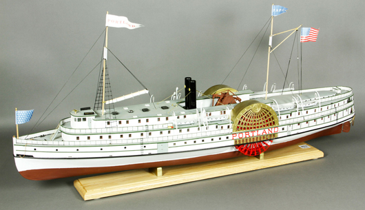Model of the coastal steamer Portland. Details include lifeboats hanging from davits, walking beam, engine, brass paddle box covers, 17 inches high x 36 inches wide x 8 inches deep. Kaminski Auctions image.