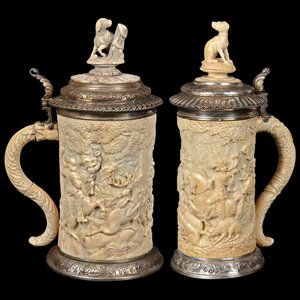 Two fine German ivory and silver mounted tankards, 15 1/2 inches high. Auction Gallery of the Palm Beaches Inc. image.