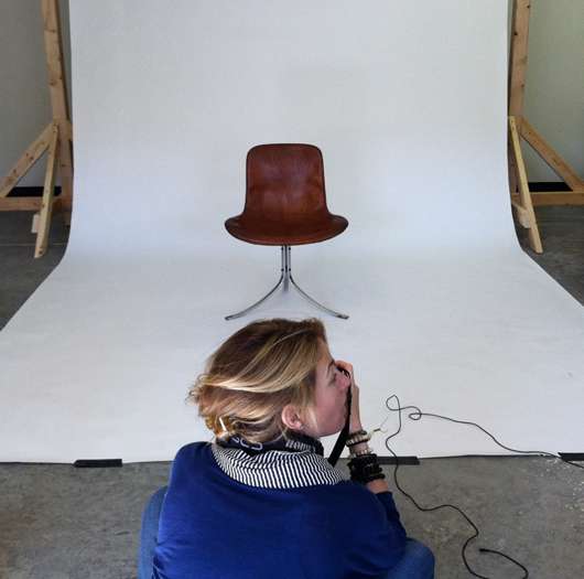 Elaine Irwin, behind the camera for a change, takes a photo of one of the many chairs in her collection.
