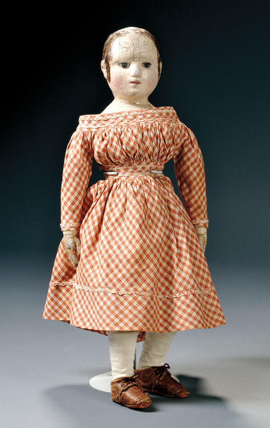 Izannah Walker cloth doll, Central Falls, R.I., mid-19th century, stockinet pressed into mold, facial features and hair oil-painted, 18 1/2 inches high. Estimate: $8,000-$12,000. Skinner Inc. image.