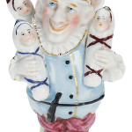 This smiling porcelain figure represents a ‘Kinder Bringen,’ a German folklore figure who brings children to brides. This jester and his children sold for $969 at a Theriault's auction in Annapolis, Md.
