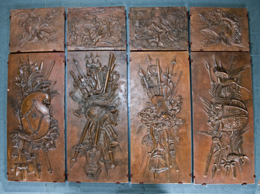 Set of four French terra-cotta relief panels, depicting trophies of war and scenes from the life of Hercules, large panels measure 67 1/2 x 22 1/2 inches, the small ones approximately 23 x 24 inches. Estimate: $10,000-$15,000. Abell Auction Co. image.
