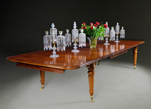 An early 19th century mahogany extending dining table from W R Harvey & Co (Antiques Ltd)