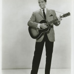Elvis Presley in a movie publicity photograph. Image courtesy of LiveAuctioneers.com and Profiles in History.