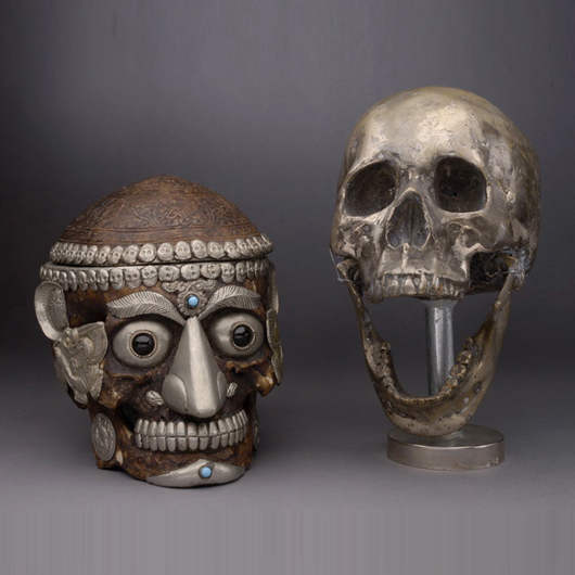 Two white metal mounted human skulls, est. $1,000-$1,500. Michaan's image.