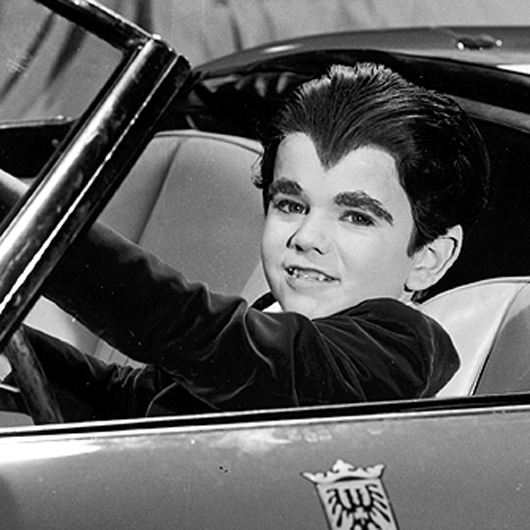 Butch takes the wheel in costume as Eddie Munster. His eye teeth were naturally fanged, which helped him get the part.