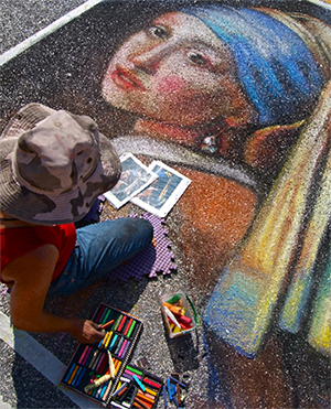 California artist Lori Escalera re-creates Vermeer's 'Girl with a Pearl Earring' at the 2007 Chalk Festival. Image by 83d40m. This work is licensed under the Creative Commons Attribution-Share-Alike 3.0 License.