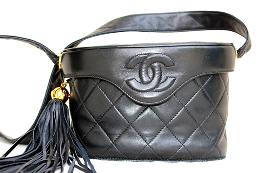 Vintage Chanel bag with tassel and long strap. The Revolving Vault image.