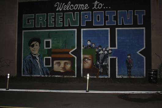 ‘Welcome to Greenpoint’ by Skewville, Brooklyn. Dockworkers who once contributed to the local economy centered on shipbuilding peer out of Skewville’s iconic block lettering. Photo by Kelsey Savage.