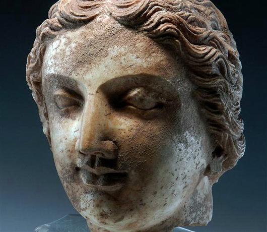 Large Indo Greek marble head of a eoman, Indus Valley, Hellenistic Period (4th ventury BC). Estimate $15,000-$20,000. Image courtesy Antiquities-Saleroom.com.