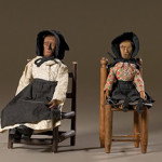 Kentucky folk art dolls, early 20th century, carved pine with articulated limbs, dressed in hand-sewn clothing and seated on ladderback chairs. Image courtesy of LiveAuctioneers.com Archive and Cowan's Auctions.