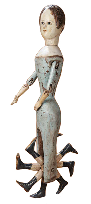 This wooden doll made in the 19th century can 'walk.' The wheel of legs turns when the doll is pushed across the floor. This doll, 20 inches tall, sold for $8,500 at a Theriault's auction in July.