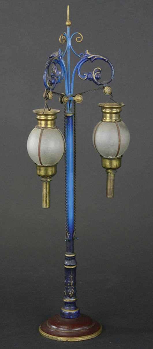 Circa-1910 Marklin cast-iron accessory lamppost with glass globes, and Art Nouveau styling, $21,240. Bertoia Auctions image.