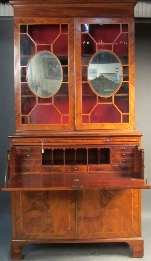 Very fine 18th-century Hepplewhite mahogany bookcase/secretary with drop-lid desk. Sterling Associates image.