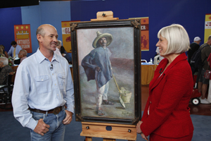 Antiques Roadshow appraiser Colleene Fesko (right) with a guest and his Diego Rivera painting. Photo courtesy of Jeffrey Dunn. All rights reserved.