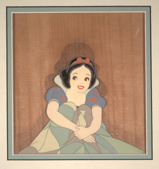Snow White sitting up in bed in Walt Disney Productions 1937 'Snow White and the Seven Dwarves.' Hess Fine Auctions image.