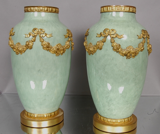 Pair of French Sevres Louis XV vases, floral and ribbon decoration, circa 1900, 14 1/2 inches tall. Est. $800-$1,200. Bruhns Auction Gallery image.