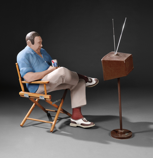 Anna Lou ‘Louie’ Rhoades figural sculpture of a man watching television. Estimate: $3,000-$5,000. Skinner Inc. image.