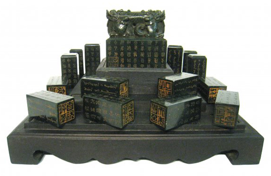 Chinese Qing imperial green jade seals in zitan box with finely carved cover (est. $1,000-$2,000). Gordon S. Converse & Co. image.