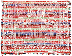 An image of Philadelphia Exposition Memorial Hall is woven into this jacquard coverlet. Designs of eagles, flowers and a figure with a wreath are also woven in. The coverlet is marked '1776-1876, Memorial Hall.' One set of letters is a mirror image because of the requirements of the loom. The coverlet was offered for sale at an Early American History Auction in Rancho Santa Fe, Calif., a few years ago.