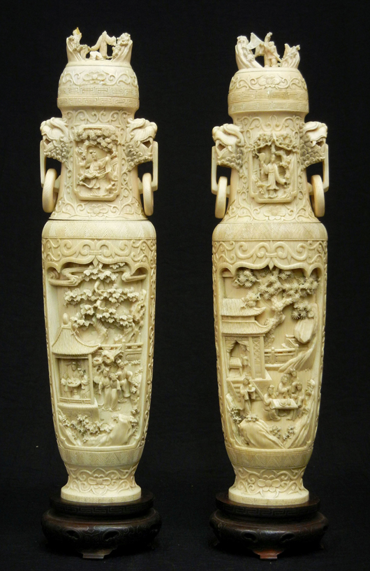Pair of Chinese carved ivory figural covered urns decorated with figural village scenes, foo dogs, circa 1890-1920, ex collection of Oliver Smalley, Epsom, England. Est. $2,000-$4,000. Stephenson’s Auctioneers image.