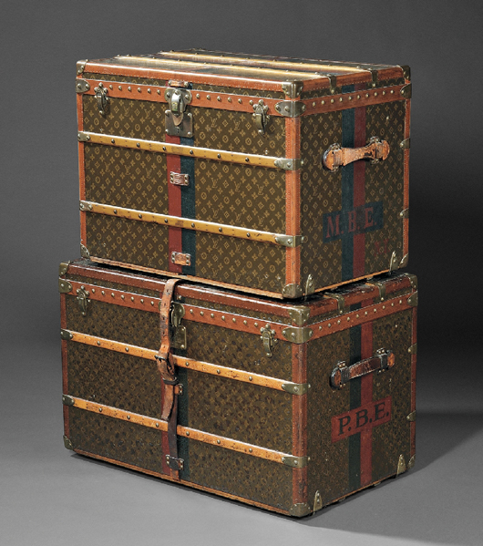 Louis Vuitton wood-strapped leather-bound trunks. Estimates: $3,000-5,000 and $1,000-1,500. Skinner Inc. image.