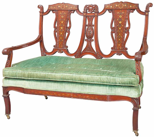 Mahogany with mother-of-pearl inlay was used to make this 1910 Edwardian settee. The back, with open spaces and scrolls, and the seat pad are typical of the period. It auctioned for only $344 at a Doyle New York auction last summer.