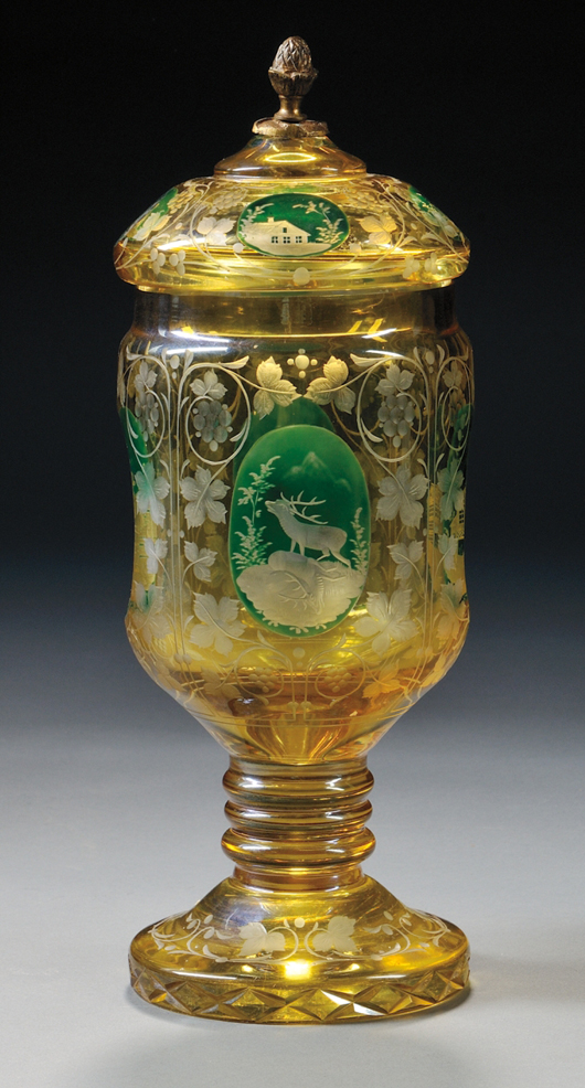Bohemian green-enameled and etched amber flash footed jar with cover, brass cover finial, 11 5/8 inches high. Estimate: $250-$350. Skinner Inc. image.