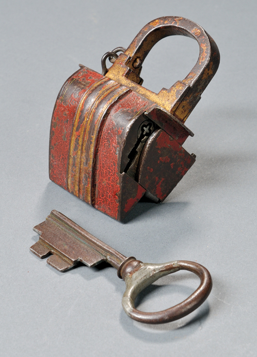 Russian gilt and red-painted iron padlock, 19th century, 3 1/8 inches long. Estimate: $600-$800. Skinner Inc. image.