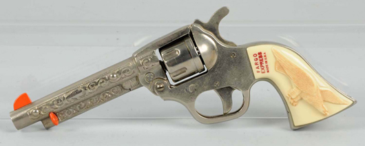 Fargo Express cap gun, arguably the rarest of Western toy guns, accompanied by original ad, $5,000. Morphy Auctions image.