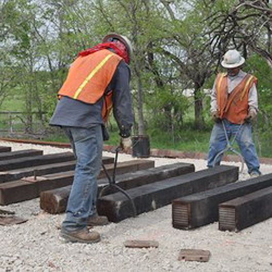 Track construction at the museum's new site commenced last March. While the ties are new, the rail was recycled from the Santa Fe (originally Kansas City, Mexico & Orient) Line near San Angelo, Texas. The rail was produced by Colorado Fuel & Iron Mills in Pueblo, and the Gary Works in Gary, Ind., between 1918 and 1920. Image courtesy of Museum of the American Railroad.