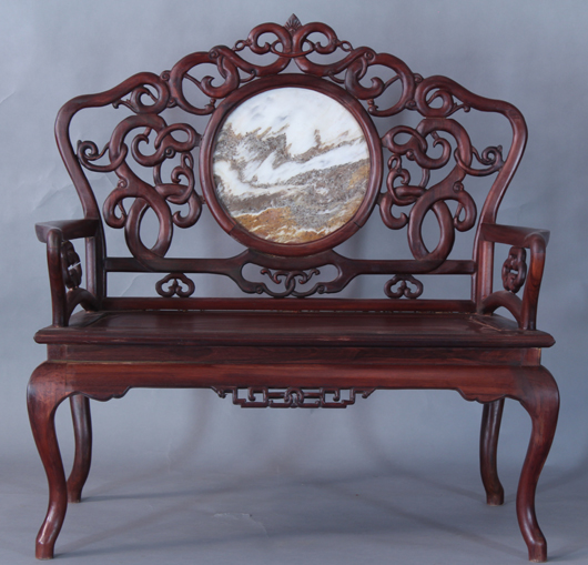 Rosewood two-seater with openwork pattern carving, probably an export item during China Republic period. China Arts image.