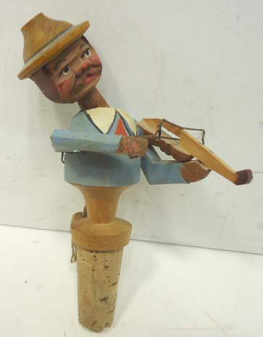 This carved wood animated bottle stopper is 6 inches tall. Image courtesy LiveAuctioneers.com Archive and Martin Auction Co.