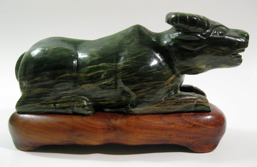 Large spinach-green jade ox, Qing Dynasty, 11.33 in. Weight: 9 lbs. Est. $3,000-$5,000. Imperial Auctioneers image.