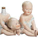 The beheaded doll has a glass decanter hidden inside, and so does her 'headed' twin. The pair sold for $969 at a June 2012 Theriault's doll auction in Annapolis, Md.