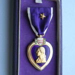 The World War II version of the Purple Heart medal in its presentation case. Image by Jonathunder. This file is made available under the Creative Commons CC0 1.0 Universal Public Domain Dedication.