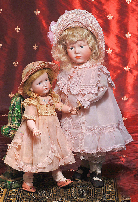 Kammer & Reinhardt characters, Marie 101 & Gretchen 114. Frasher’s Doll Auctions image.