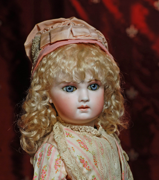 Early French bebe with extreme almond-shaped eyes, 18 inches, attributed to Schmitt & Fils. Frasher’s Doll Auctions image.