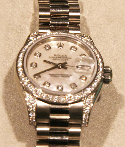 Rolex women’s diamond and white gold watch. Government Auction image.