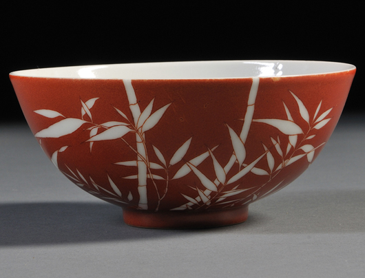 Red bowl, China, 19th century, with reverse design of bamboo on overglaze red to the foot, six-character Guangxu mark on recessed base. Estimate: $600-$800. Skinner Inc. image.