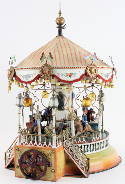 Exquisitely detailed circa-1910 Marklin carousel, crank or steam driven, top lot of the sale, $218,500. Noel Barrett Auctions image.