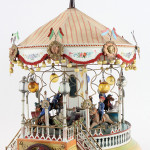 Exquisitely detailed circa-1910 Marklin carousel, crank or steam driven, top lot of the sale, $218,500. Noel Barrett Auctions image.
